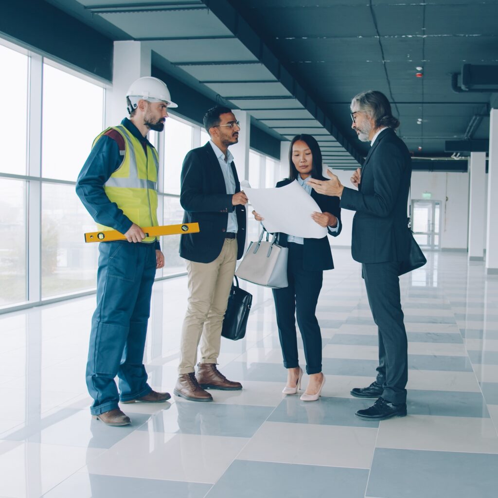 A group of construction project managers and investors discussing a project